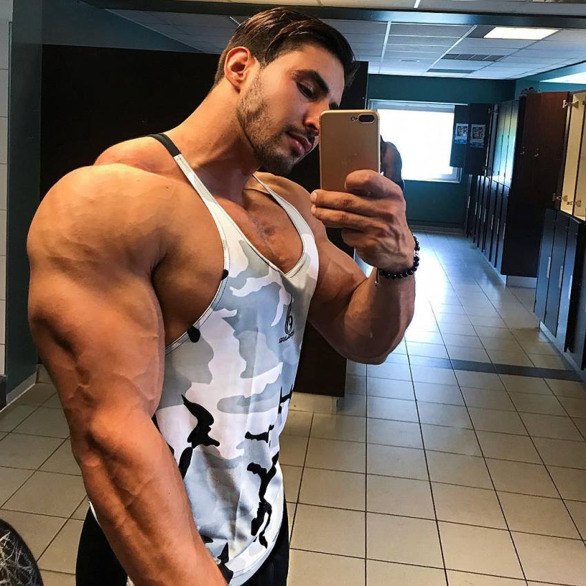 Amin Elkach taking a selfie of his big and muscular arm