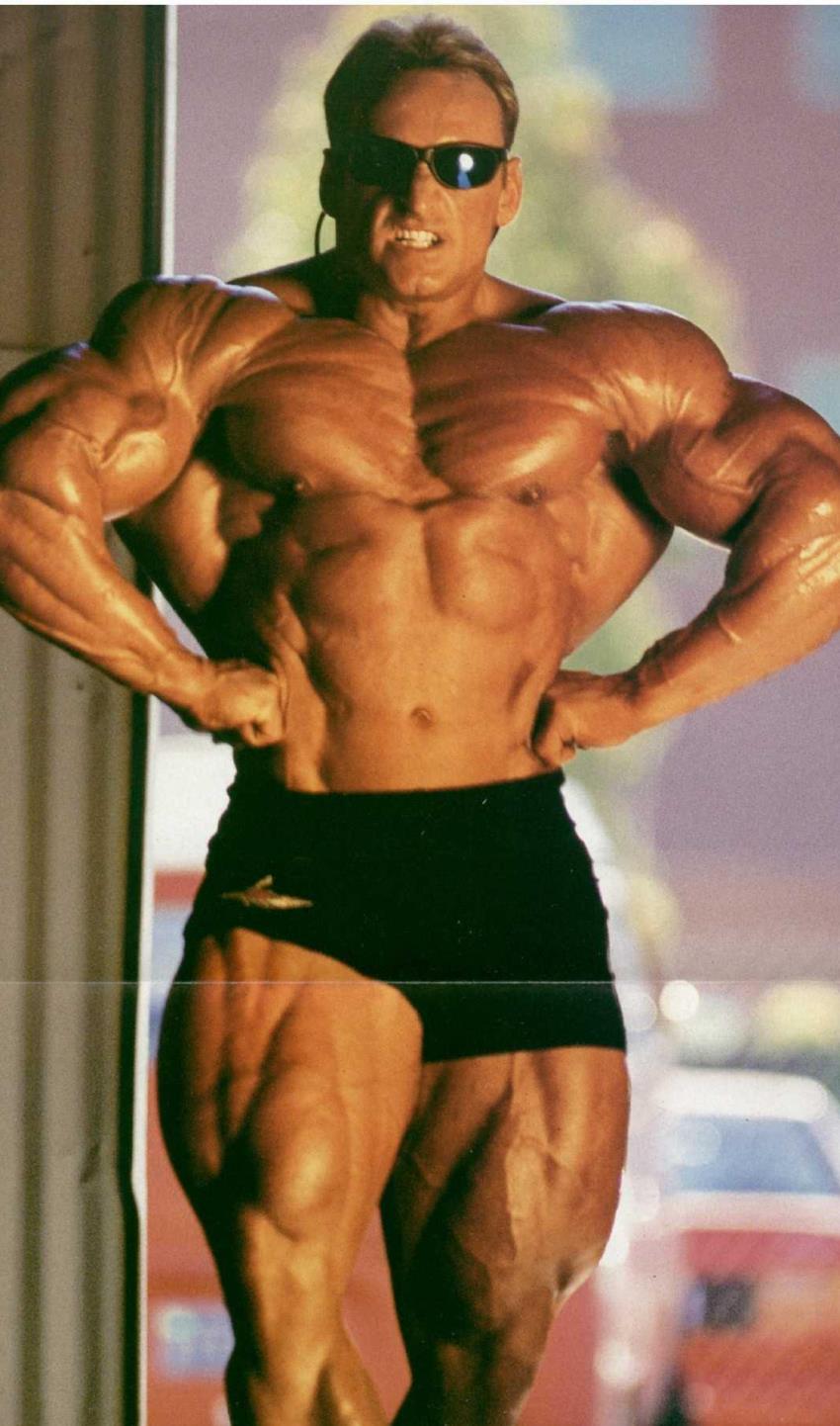 Andreas Munzer flexing his lats for the camera