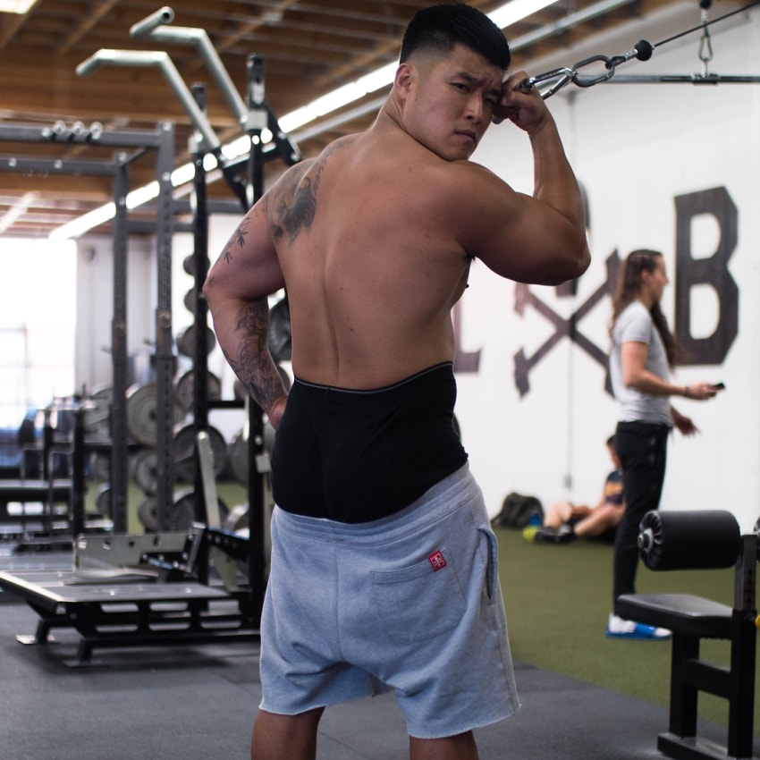 Bart Kwan showing his fit back muscles