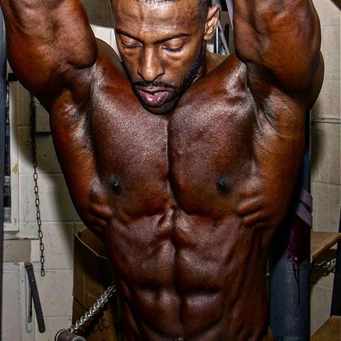 Coty Hart flexing his chiseled abs for the camera