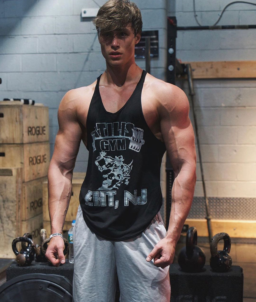 David Laid wearing a stringer vest in a photo shoot.