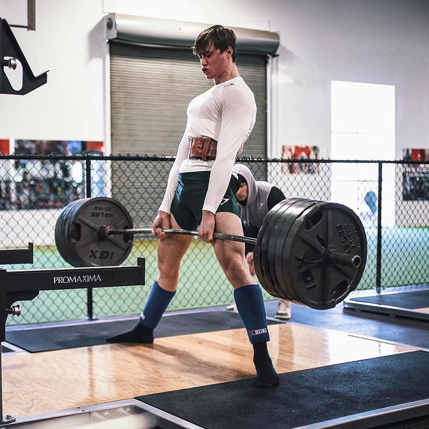 David Laid performing deadlifts in the gym.