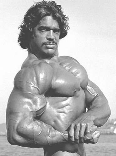 Denny Gable doing an impressive side chest pose