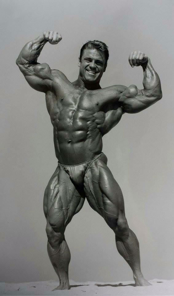 Eddie Robinson flexing in a photo shoot.