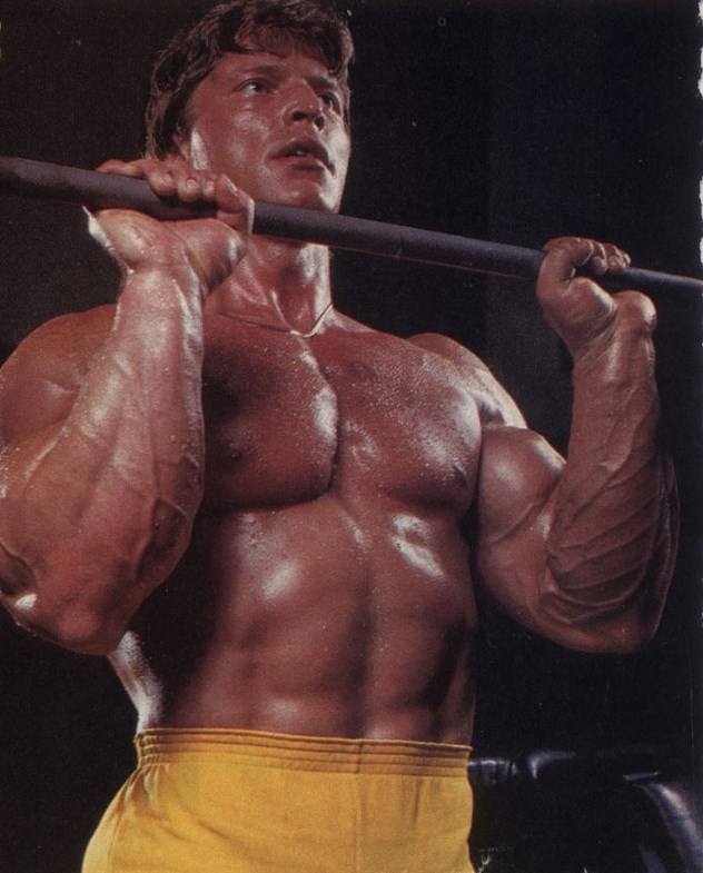 Gunnar Rosbo training shirtless with a barbell.