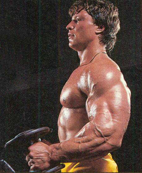 Gunnar Rosbo training with dumbbells, his arms and forearms looking huge