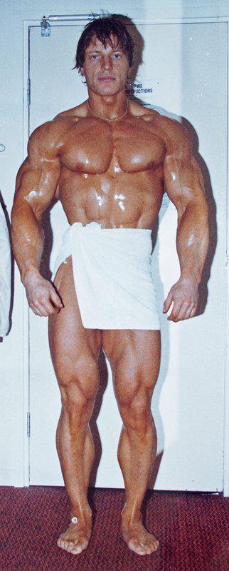 Gunnar Rosbo showing his ripped and muscular physique with a towel covering him