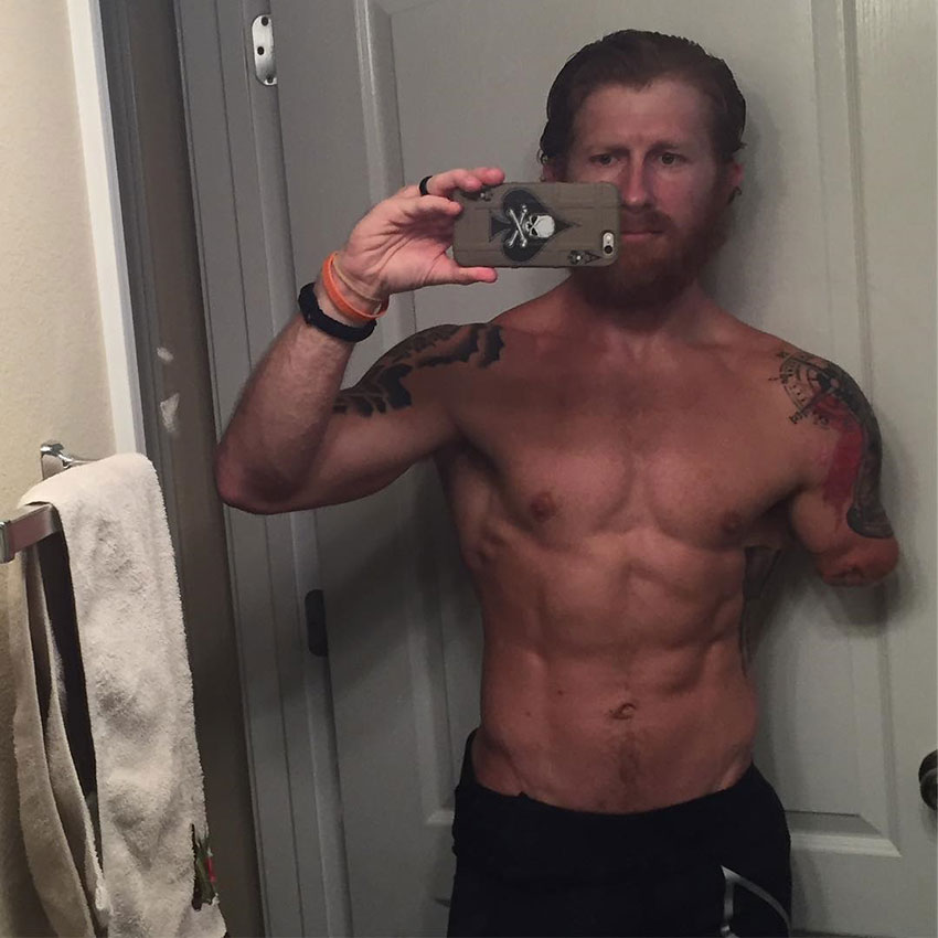 Jared Bullock taking a selfie in his bathroom showing his pre-competition body.