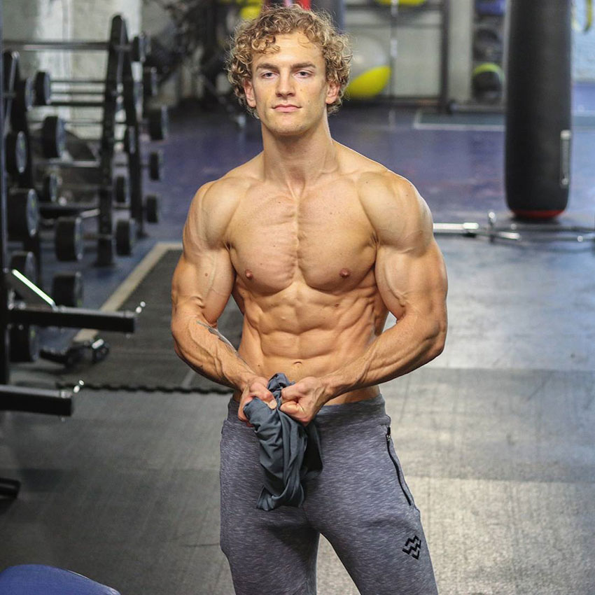 Joe Delaney showing off his shredded body in the gym.