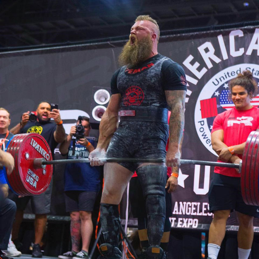 KC Mitchell performing a deadlift in a competition.