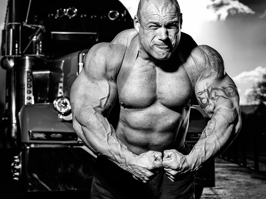 Morgan Aste pulling a large vehicle at a strongman event