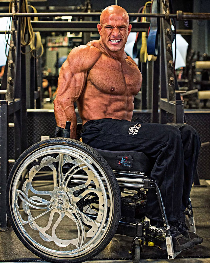 Nick Scott posing in his wheelchair.