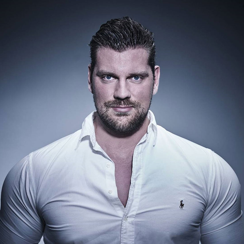 Olivier Richters in a photo shoot wearing a white shirt.