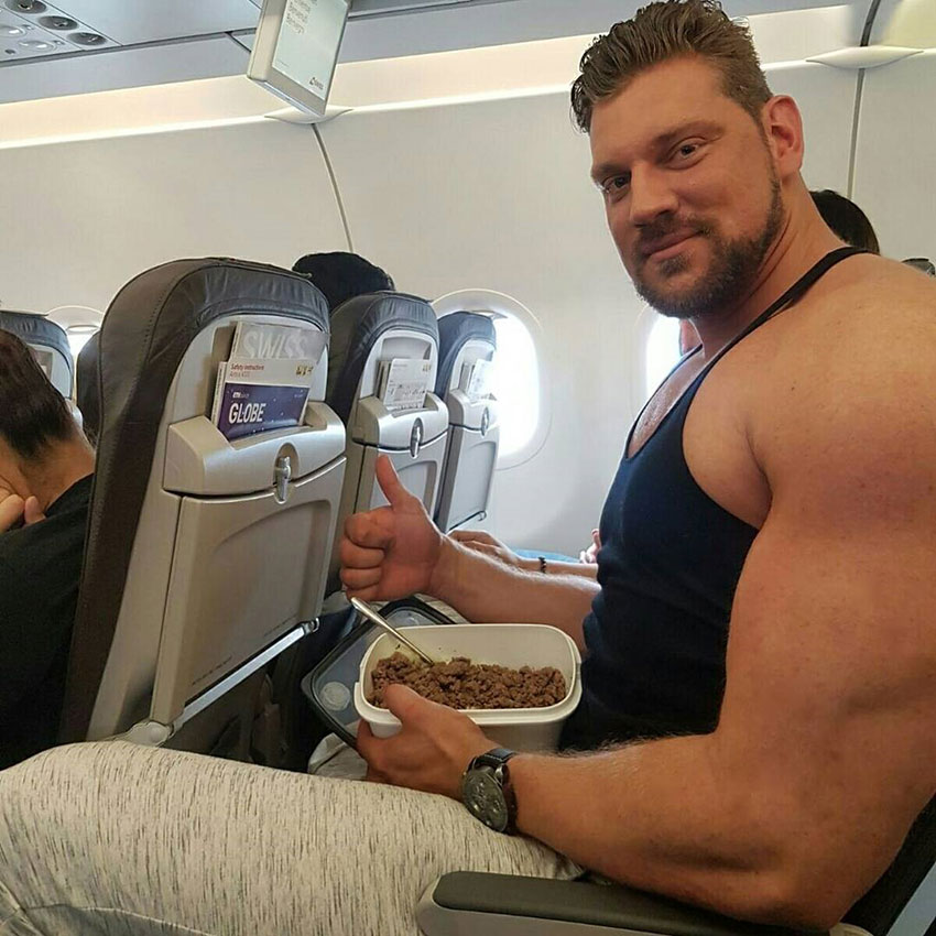 Olivier Richters sat on a plane eating a meal