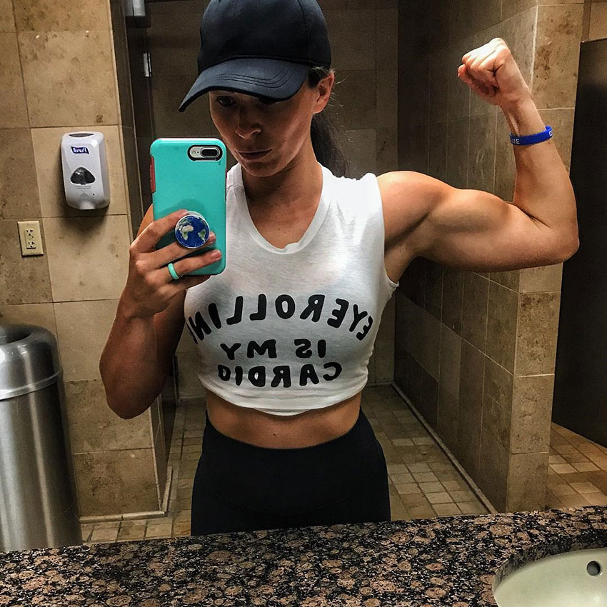 Sarah Bowmar flexing her arm taking a selfie.