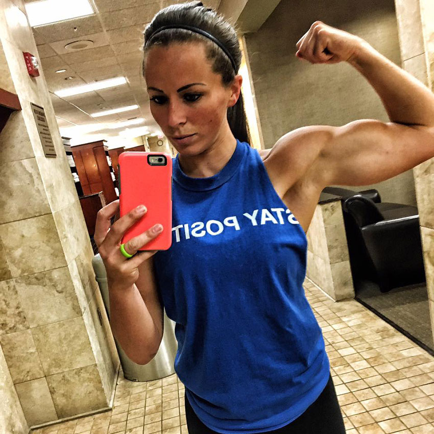 Sarah Bowmar flexing her arm taking a selfie.