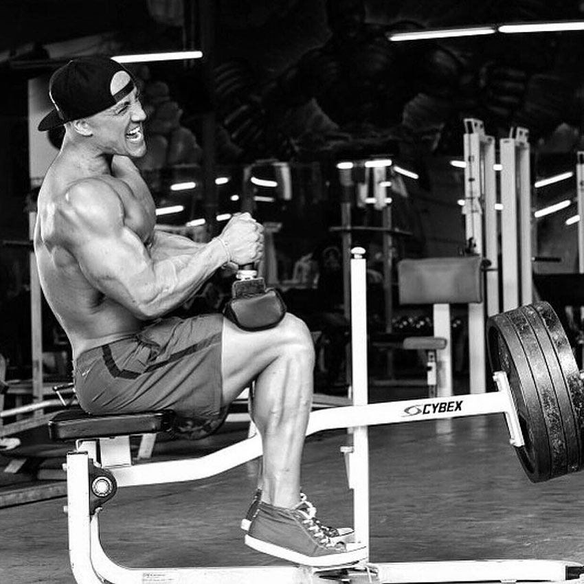 Anthony Perez performing seated calf raises.