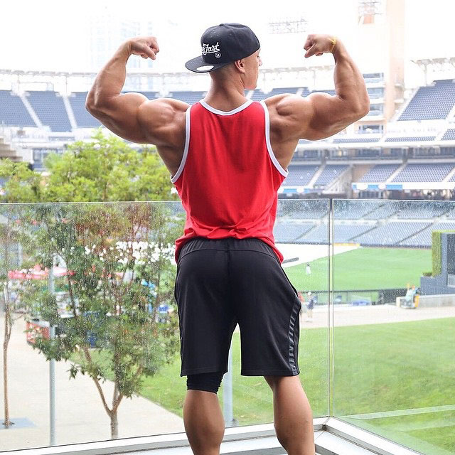 Anthony Perez flexing his biceps.