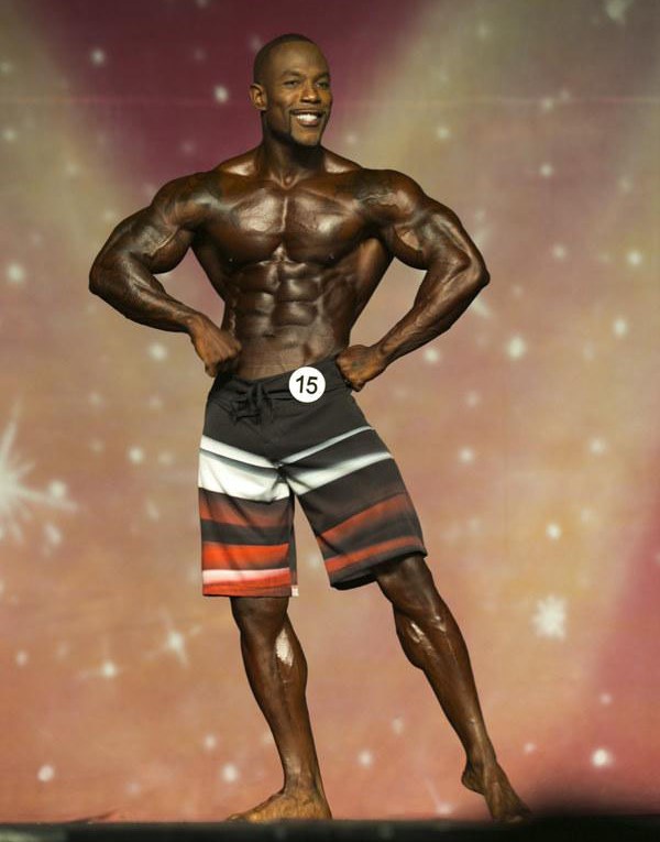 Antoine Williams posing on the bodybuilding stage