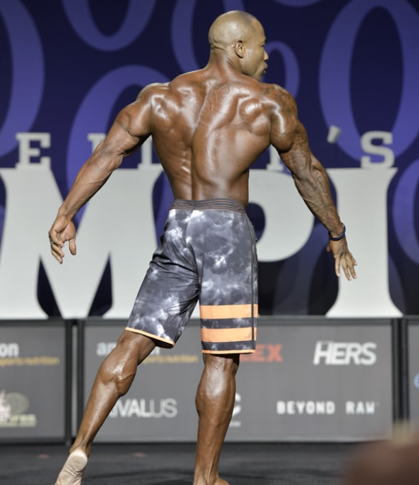 Antoine Williams showcasting his ripped back at the Mr. Olympia Men's Physique competition