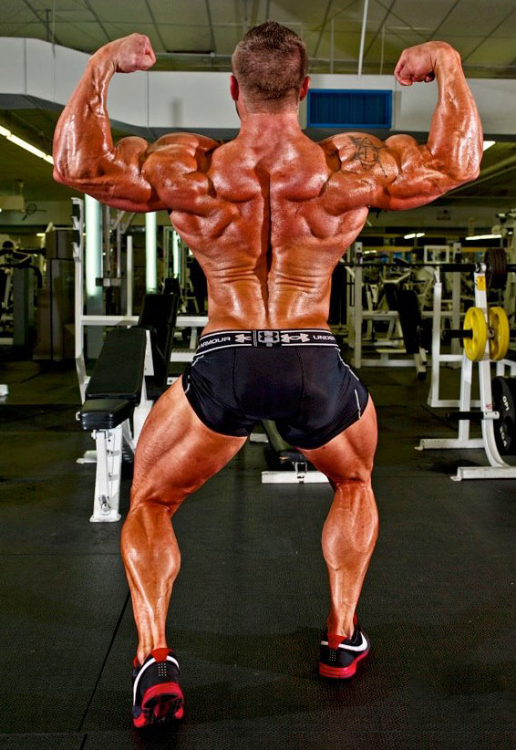 Brad Rowe showing off his back muscles.