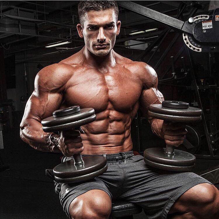 Chase Savoie holding dumbbells in a photo shoot.