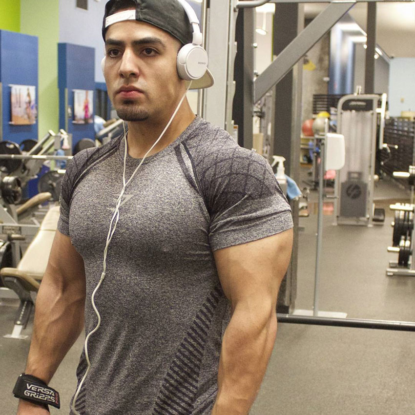 Chris Lavado posing in the gym.