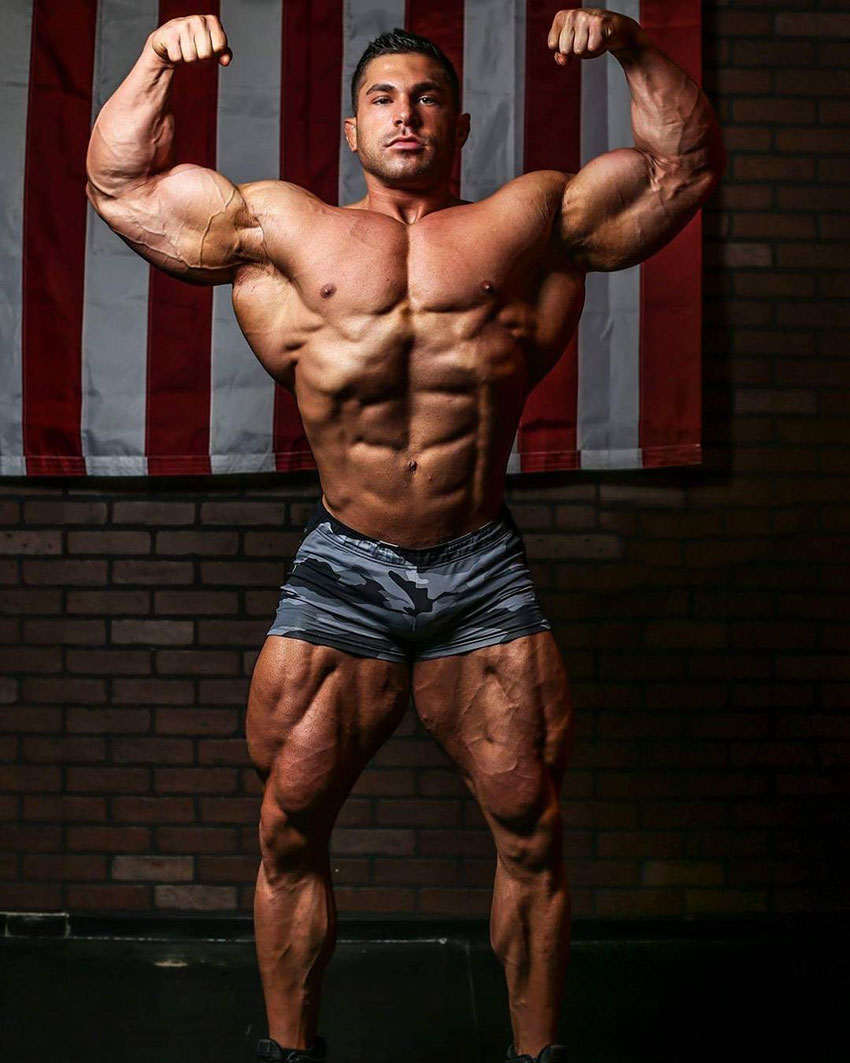 Derek Lunsford showing off his great physique while flexing his biceps.