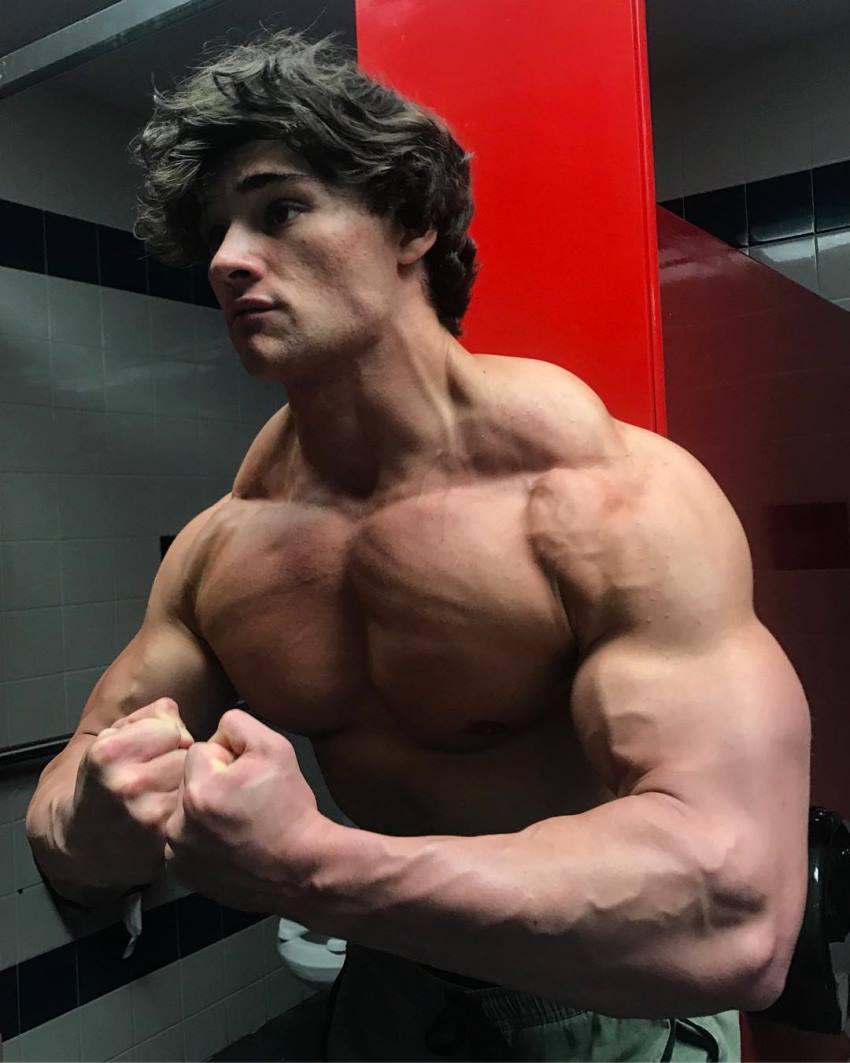 Dylan McKenna doing a most muscular pose, looking big and lean