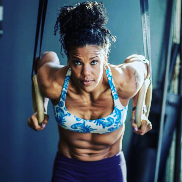 Elizabeth Akinwale exercising with rings.