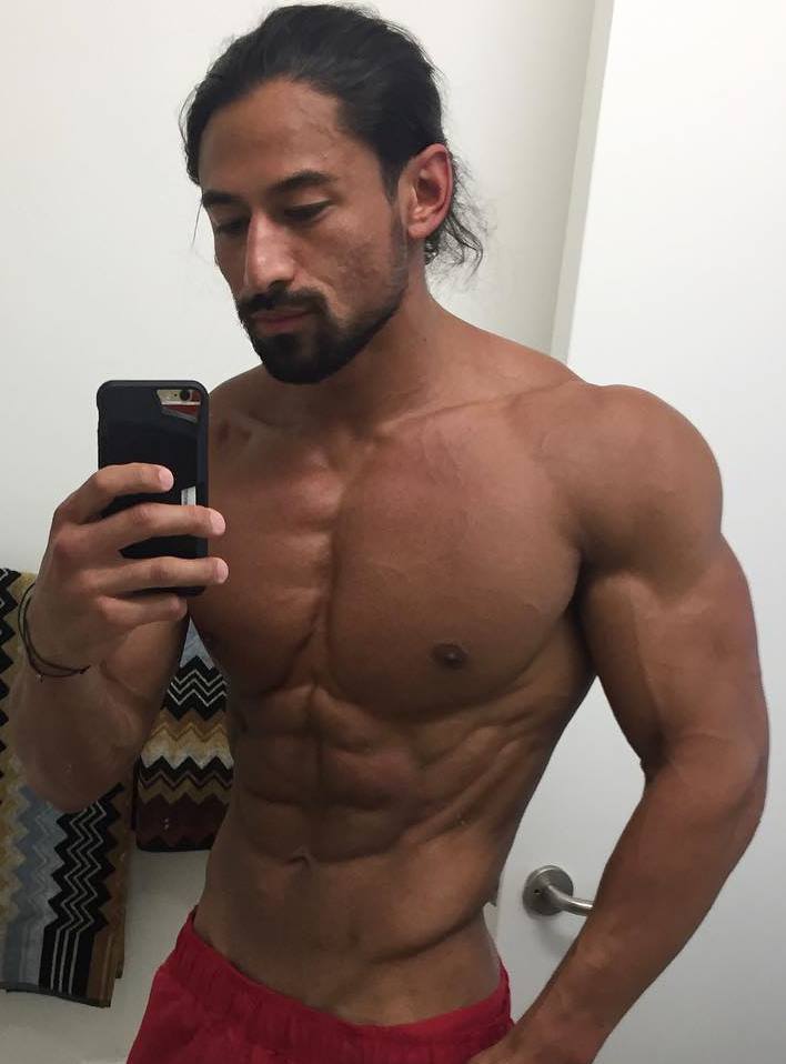 Justin Gonzales taking a selfie of his ripped upper body