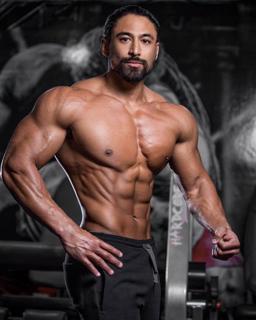 Justin Gonzales showcasting his ripped upper body for the photo