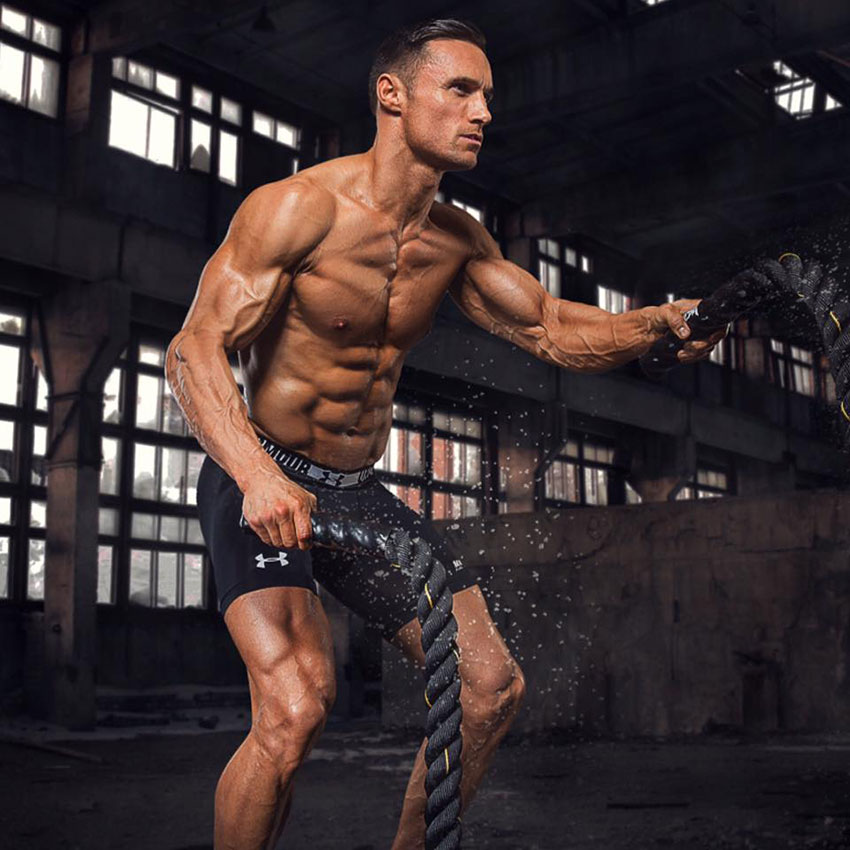 Kirk Miller using battle ropes in the gym.