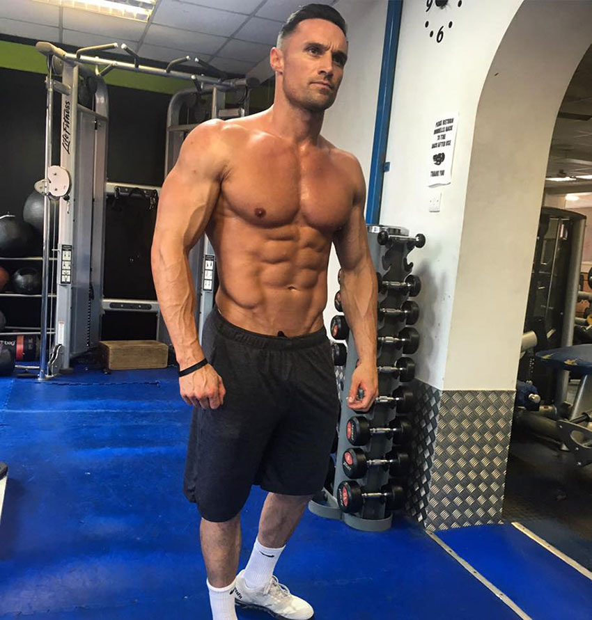 Kirk Miller posing in the gym.