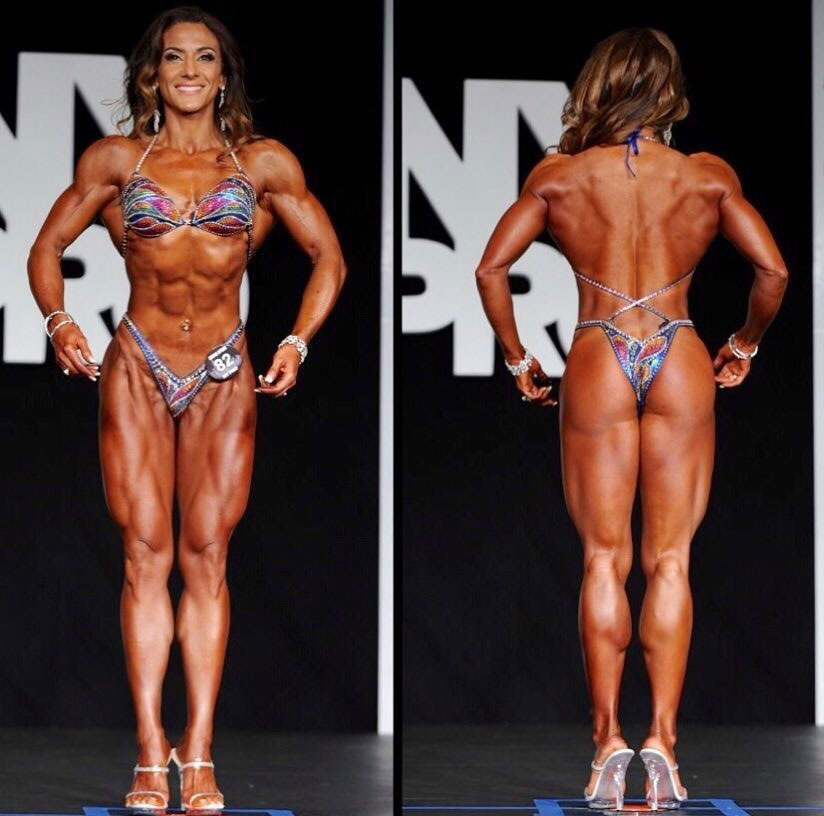Maggie Corso posing on the bodybuilding stage.