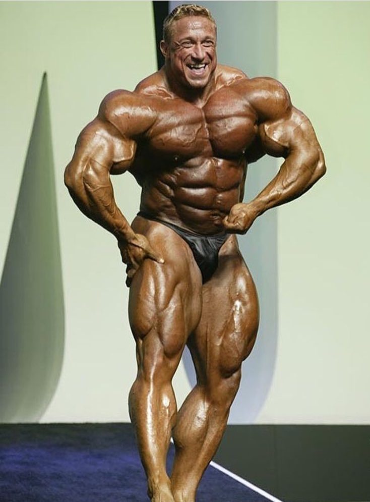 Markus Ruhl on the bodybuilding stage showcasting his impressively conditioned physique