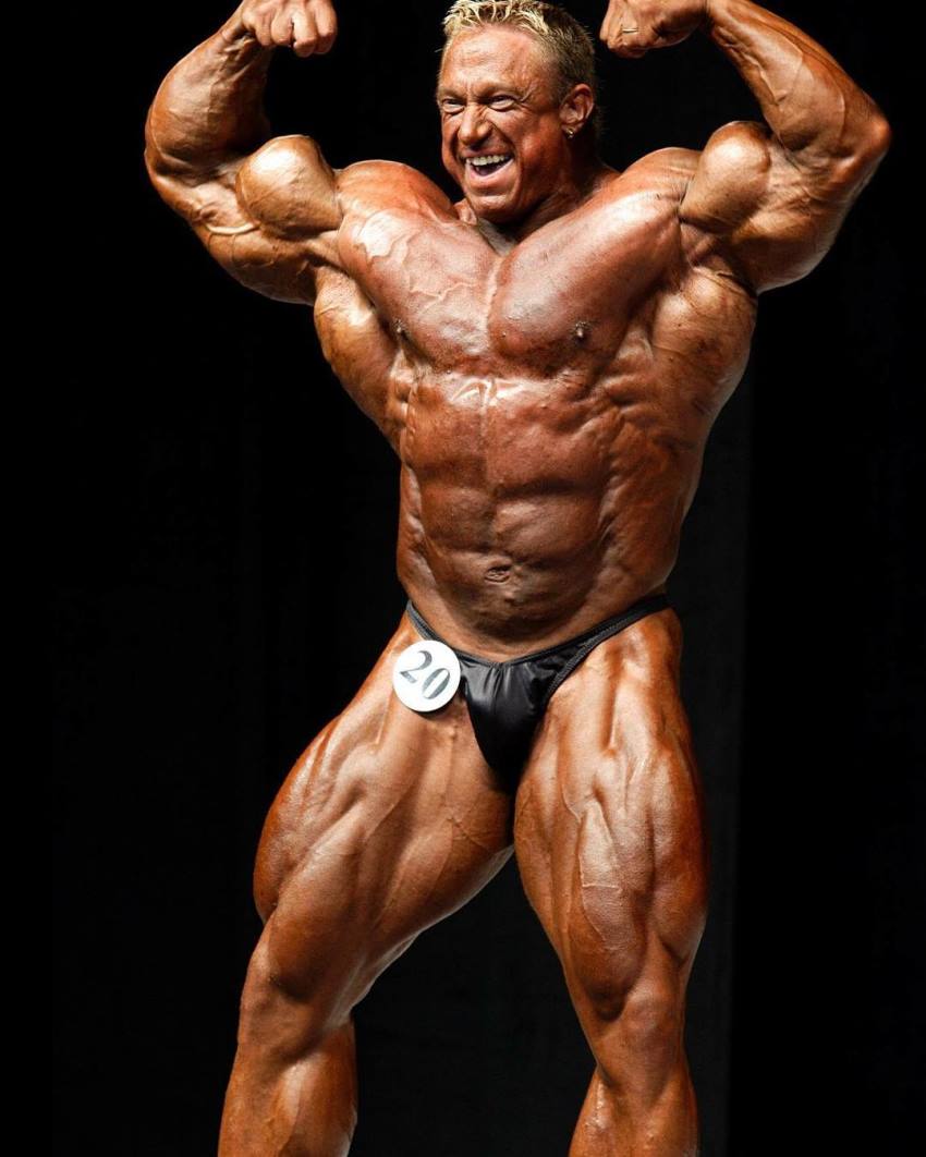 Markus Ruhl doing front double biceps pose on the bodybuilding stage