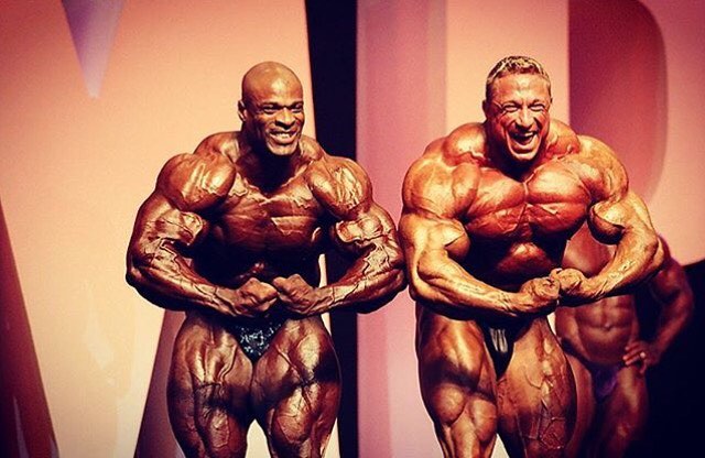Markus Ruhl posing with Ronnie Coleman on the bodybuilding stage