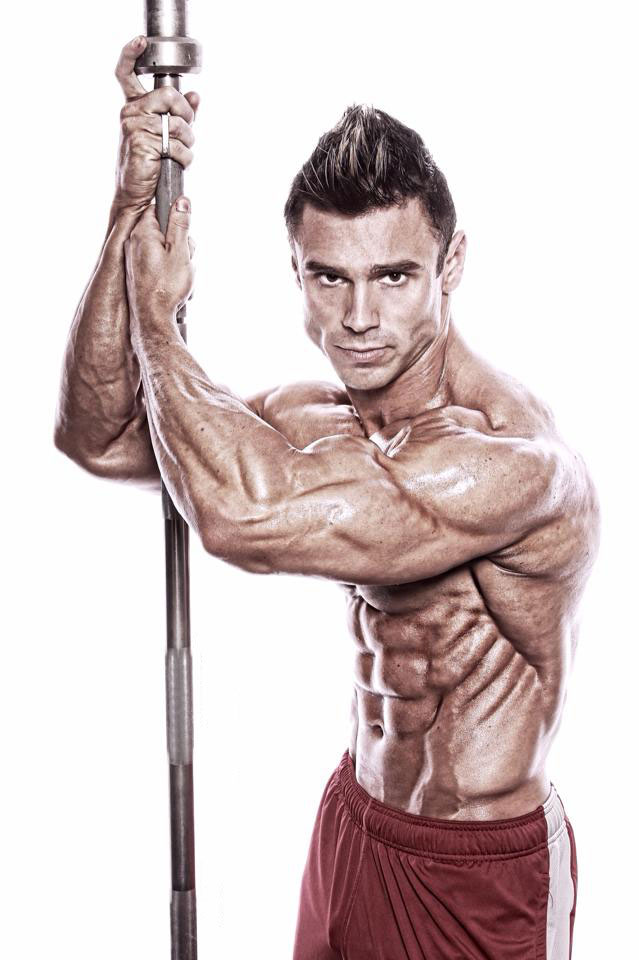 Matt Christianer holding a barbell in a photo shoot.