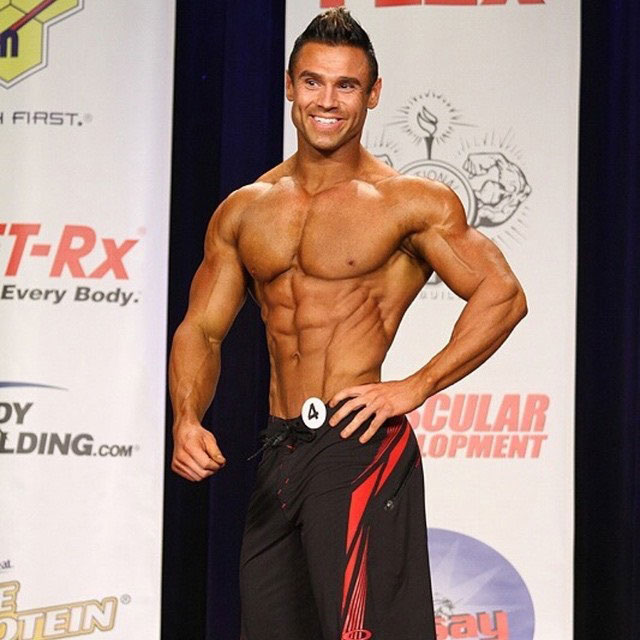 Matt Christianer posing on the bodybuilding stage.