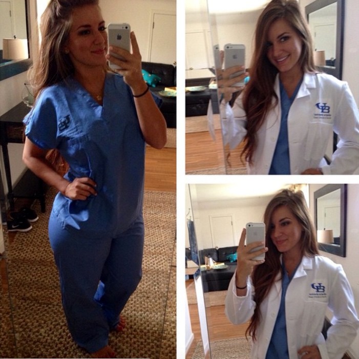 Mindy Sittinpretty posing taking a photo in her medical uniform