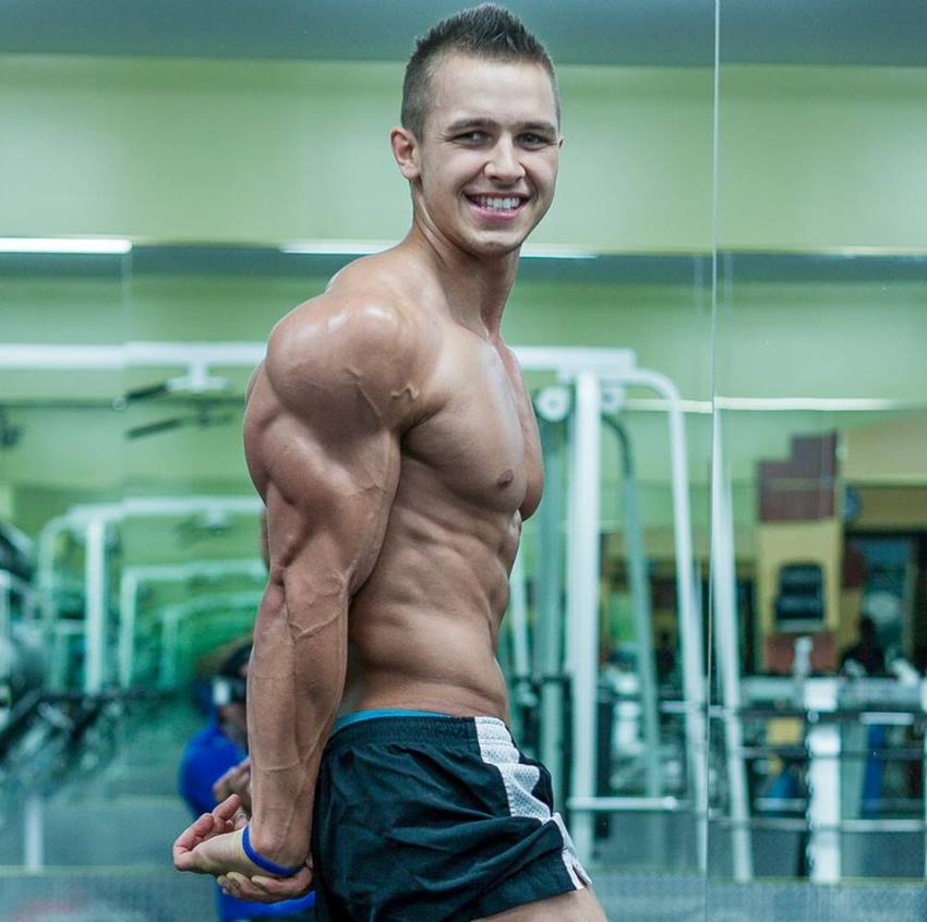 Regan Grimes in a side triceps pose when he was 18 years old