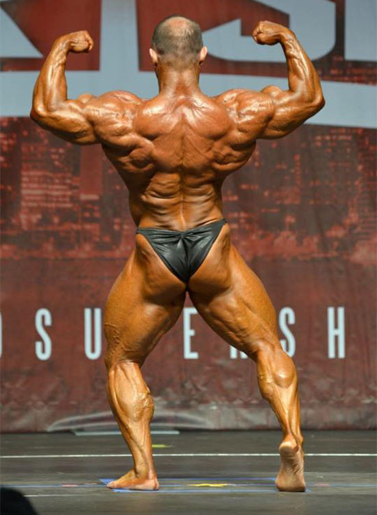 Ronnie Rockel showing off his back muscles on the bodybuilding stage.