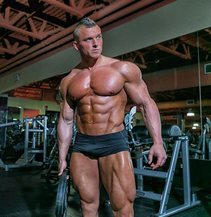 Samuel Dixon posing in a gym photo shoot.