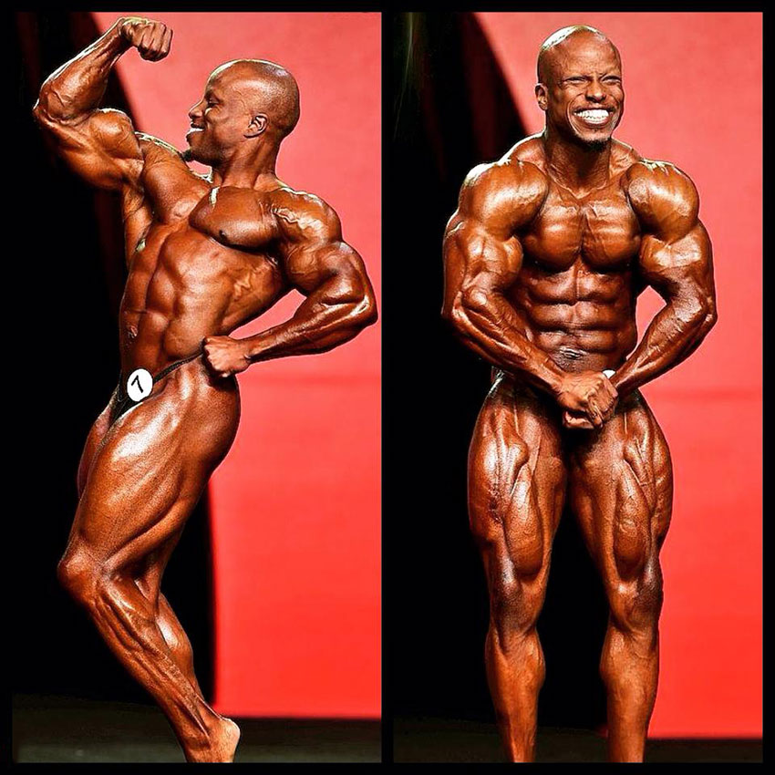 Shaun Clarida posing on the bodybuilding stage.