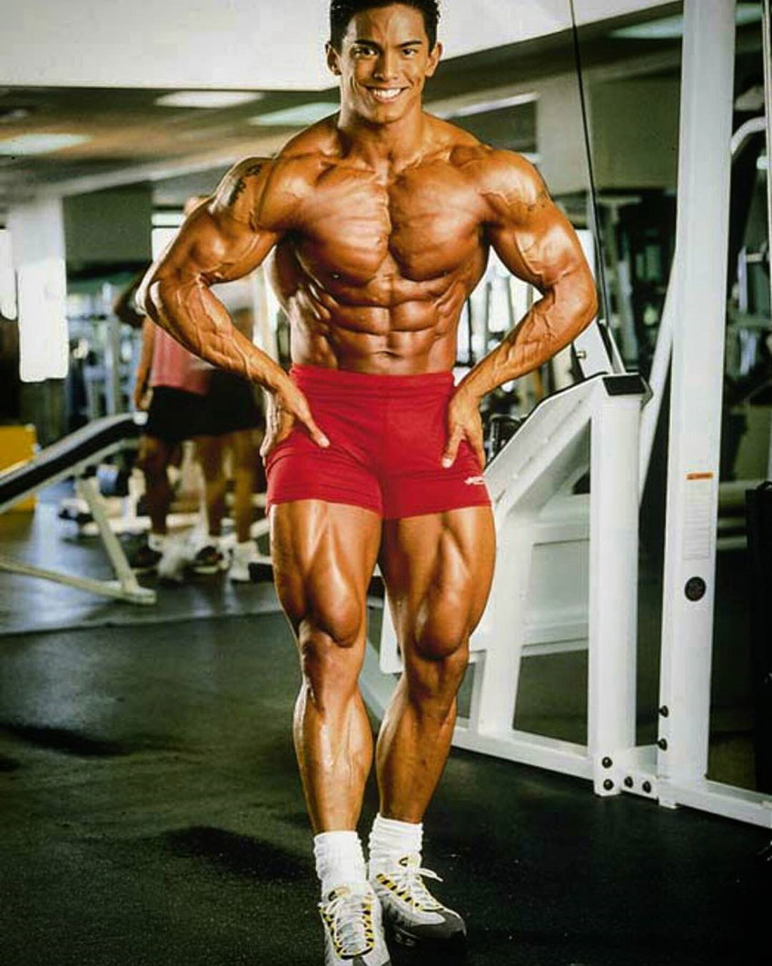 Stan McQuay showing off his muscular physique in the gym.