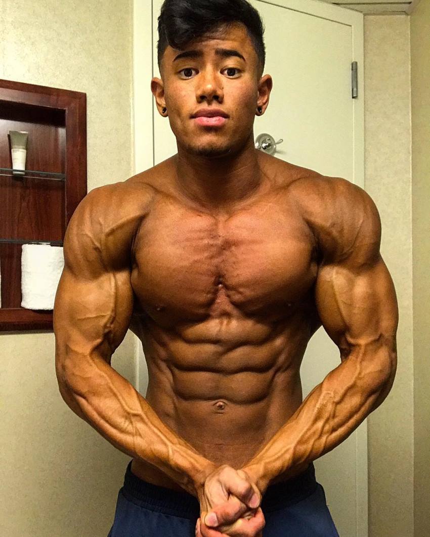 Steven Cao flexing his muscles, looking tanned up and ripped