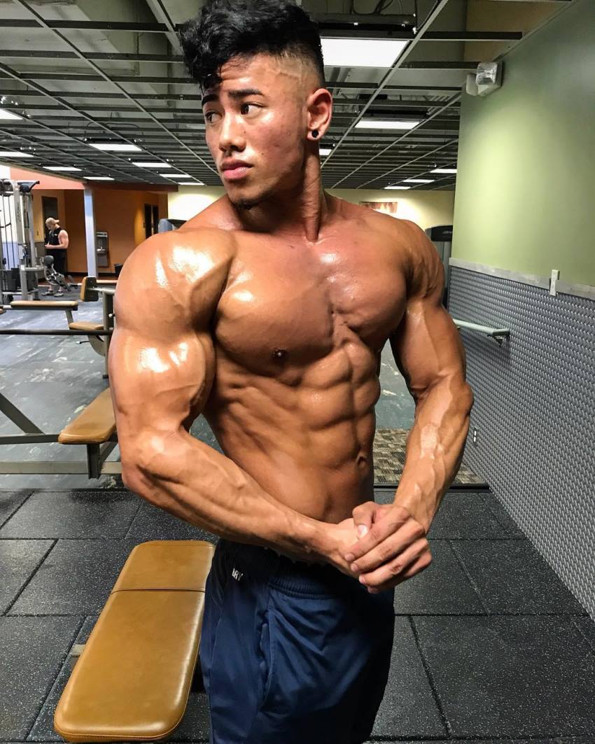 Steven Cao side chest pose flexing shirtless