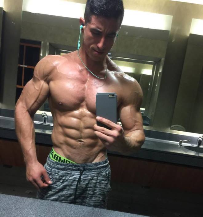 Tomas Echavarria taking a selfie of his ripped physique