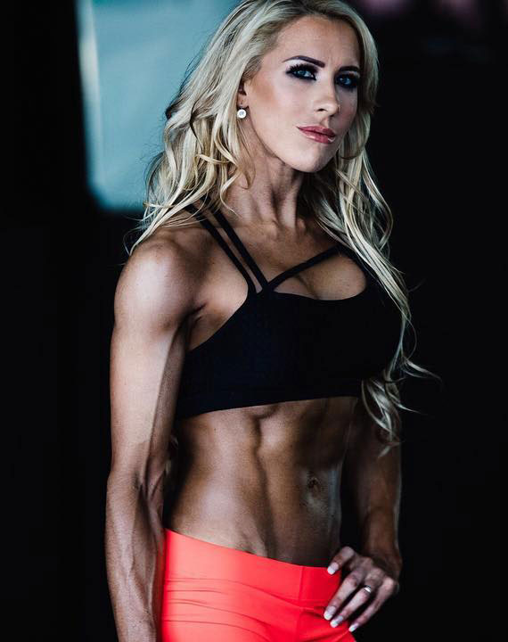 Anna McManamey showing off her lean, ripped abs in a photo shoot.